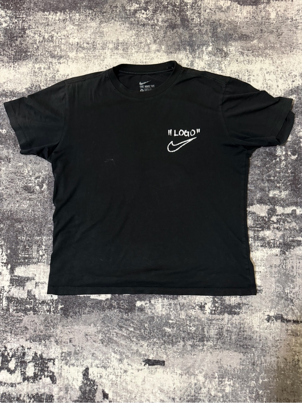 Nike Black Short Sleeve Tee with White Swoosh and "Logo" Text